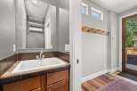 This charming property features a well-appointed bathroom with a stylish sink and ample storage.