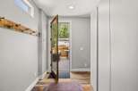 Step into this inviting entryway, showcasing a blend of rustic charm and modern design.