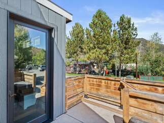 Enjoy the serene views from this charming property, featuring a private deck and a modern design.