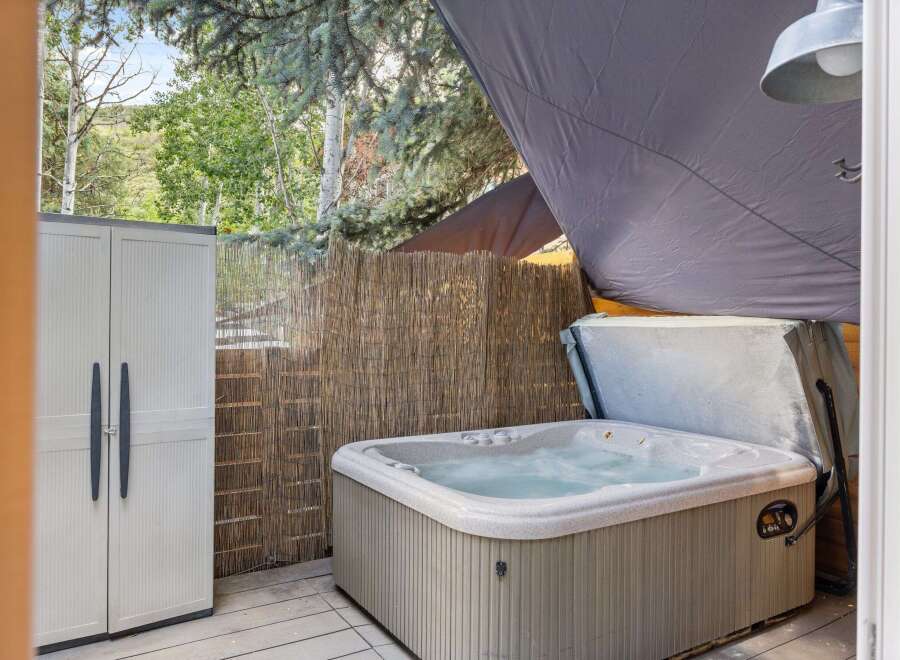 Relax and unwind in this luxurious hot tub, perfect for enjoying the outdoors.