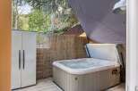 Relax and unwind in this luxurious hot tub, perfect for enjoying the outdoors.