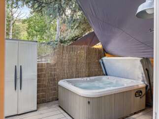 Relax and unwind in this luxurious hot tub, perfect for enjoying the outdoors.