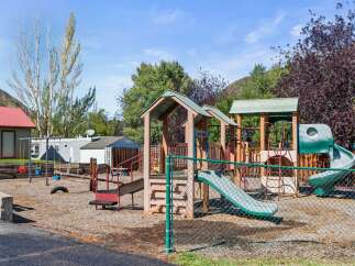 This property boasts a fantastic playground, perfect for families with children.