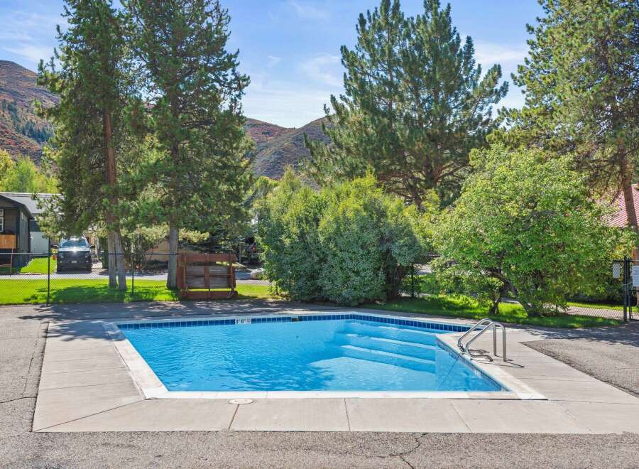 Enjoy the refreshing pool on a sunny day! This property features a beautiful outdoor pool, perfect for relaxation and recreation.