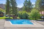 Enjoy the refreshing pool on a sunny day! This property features a beautiful outdoor pool, perfect for relaxation and recreation.