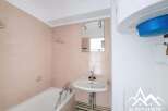 Discover this charming bathroom featuring a bathtub and a sink, perfect for your daily routines.