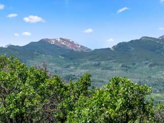 Nestled amidst the majestic mountains, this property offers breathtaking views and a serene escape.
