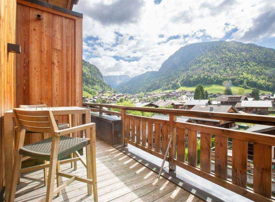 Enjoy breathtaking mountain views from this stunning balcony.