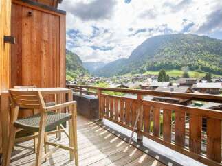 Enjoy breathtaking mountain views from this stunning balcony.