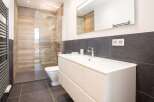 Step into modern luxury with this stunning bathroom! Featuring a sleek vanity, a spacious walk-in shower, and elegant tile work, this space is designed for both style and functionality.