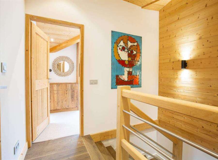 Step into this inviting space, featuring a blend of natural wood elements and modern design.