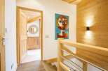 Step into this inviting space, featuring a blend of natural wood elements and modern design.