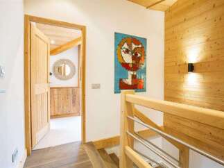 Step into this inviting space, featuring a blend of natural wood elements and modern design.