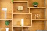 This stunning property boasts a custom-built wooden shelving unit, perfect for displaying decor and adding character.