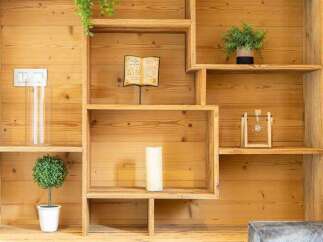 This stunning property boasts a custom-built wooden shelving unit, perfect for displaying decor and adding character.