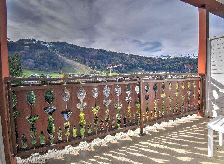 Enjoy breathtaking mountain views from this charming balcony.