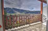 Enjoy breathtaking mountain views from this charming balcony.