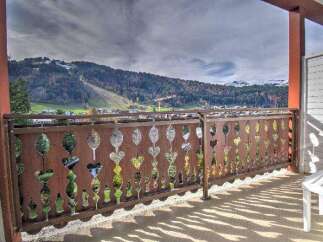 Enjoy breathtaking mountain views from this charming balcony.