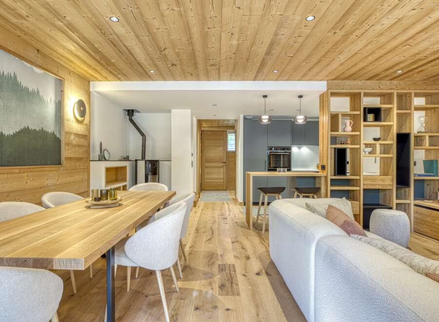 This stunning property boasts a warm and inviting interior, featuring beautiful wooden accents throughout.