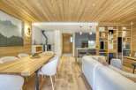 This stunning property boasts a warm and inviting interior, featuring beautiful wooden accents throughout.