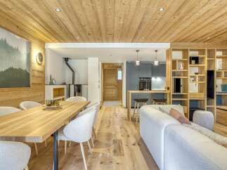 This stunning property boasts a warm and inviting interior, featuring beautiful wooden accents throughout.