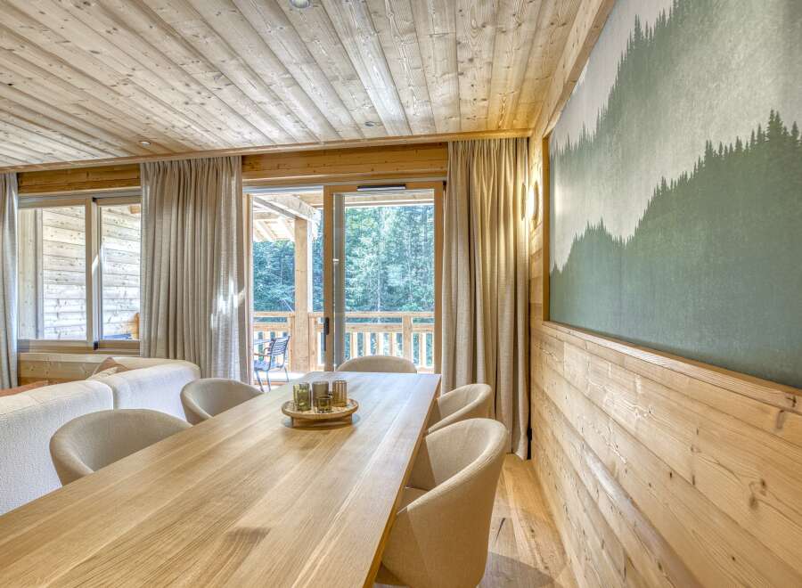 This stunning property boasts a warm and inviting interior, featuring beautiful wooden accents throughout.