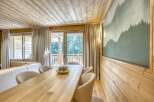 This stunning property boasts a warm and inviting interior, featuring beautiful wooden accents throughout.
