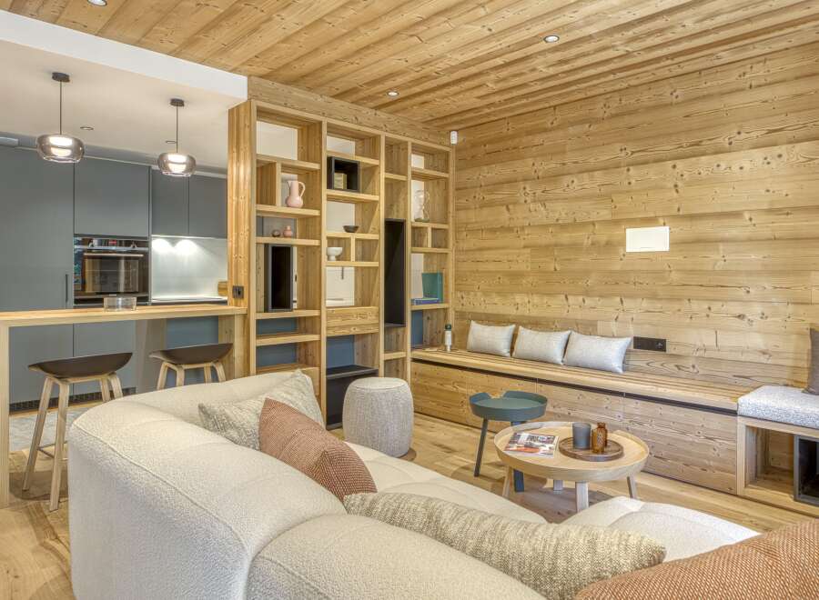 This stunning property boasts a warm and inviting interior with beautiful wooden accents throughout.