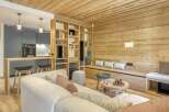 This stunning property boasts a warm and inviting interior with beautiful wooden accents throughout.
