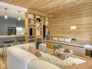 This stunning property boasts a warm and inviting interior with beautiful wooden accents throughout.