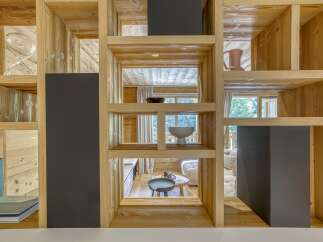 This stunning property showcases a unique architectural design with a focus on natural materials.