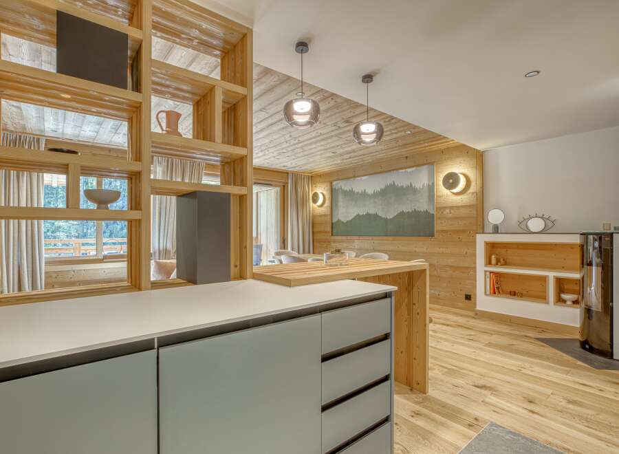 This stunning property boasts a modern kitchen with sleek cabinetry and a spacious layout, perfect for culinary enthusiasts.