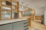 This stunning property boasts a modern kitchen with sleek cabinetry and a spacious layout, perfect for culinary enthusiasts.