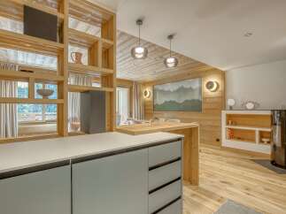 This stunning property boasts a modern kitchen with sleek cabinetry and a spacious layout, perfect for culinary enthusiasts.