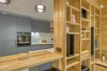 This stunning kitchen boasts a modern design with a warm, inviting feel.