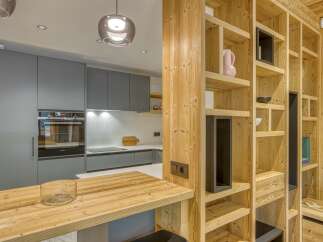 This stunning kitchen boasts a modern design with a warm, inviting feel.