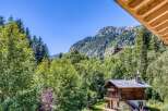Nestled in a serene mountain setting, this charming chalet offers breathtaking views and a tranquil escape.