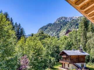 Nestled in a serene mountain setting, this charming chalet offers breathtaking views and a tranquil escape.