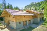 This stunning wooden chalet offers a perfect blend of rustic charm and modern comfort.