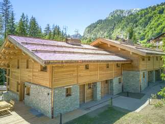 This stunning wooden chalet offers a perfect blend of rustic charm and modern comfort.