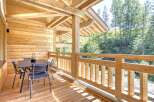 Enjoy the tranquility of this stunning wooden balcony, perfect for relaxing and taking in the surrounding natural beauty.