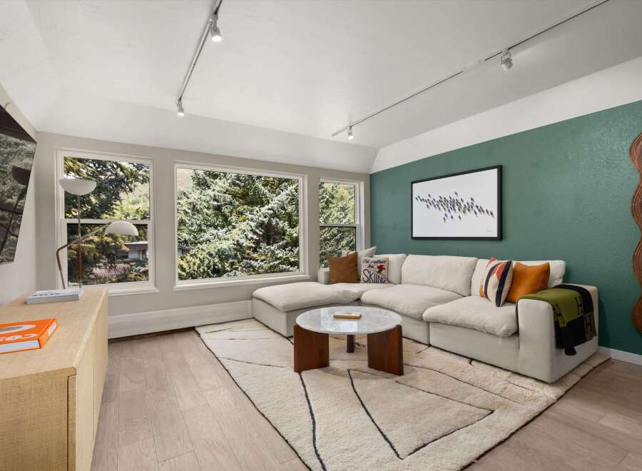 Step into luxury with this stunning living room, featuring a modern sectional sofa and a chic coffee table.