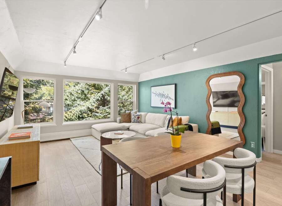 Step into modern elegance with this stunning property, featuring a spacious living area bathed in natural light.