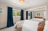 Step into this inviting bedroom, featuring a serene ambiance and stylish decor.