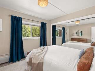 Step into this inviting bedroom, featuring a serene ambiance and stylish decor.
