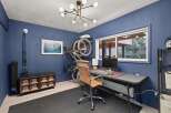 This home office space is designed for productivity and fitness.