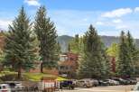 Discover a charming property nestled amidst lush greenery and stunning mountain views.