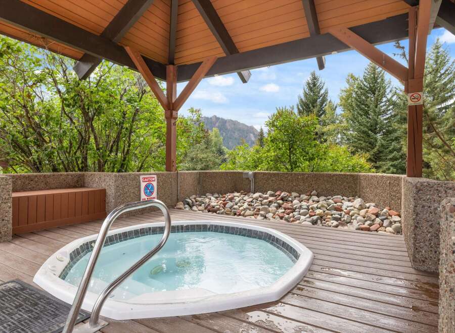 Relax and unwind in this luxurious hot tub, nestled in a serene outdoor setting.