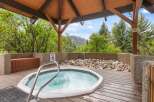 Relax and unwind in this luxurious hot tub, nestled in a serene outdoor setting.