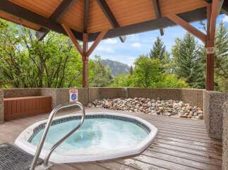 Relax and unwind in this luxurious hot tub, nestled in a serene outdoor setting.
